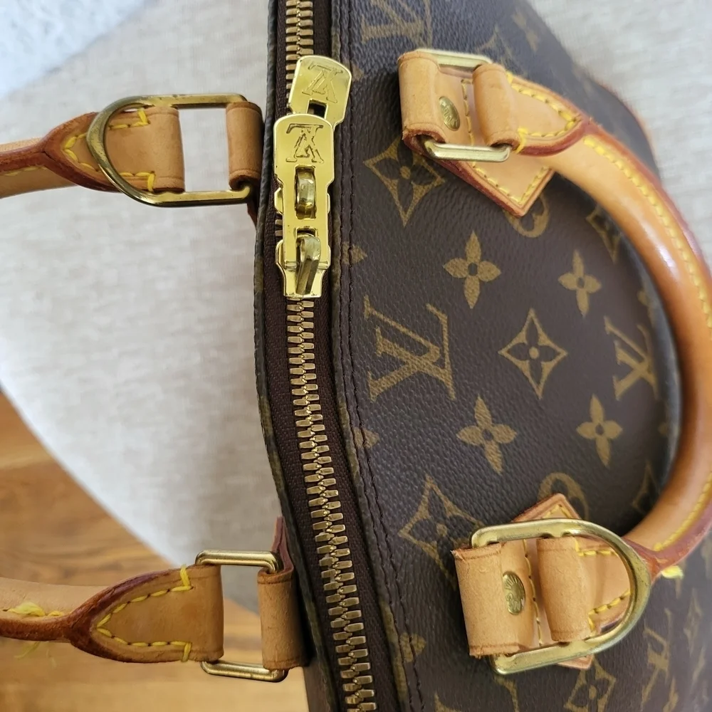 Authentic Louis Vuitton Monogram Alma PM Hand Bag..